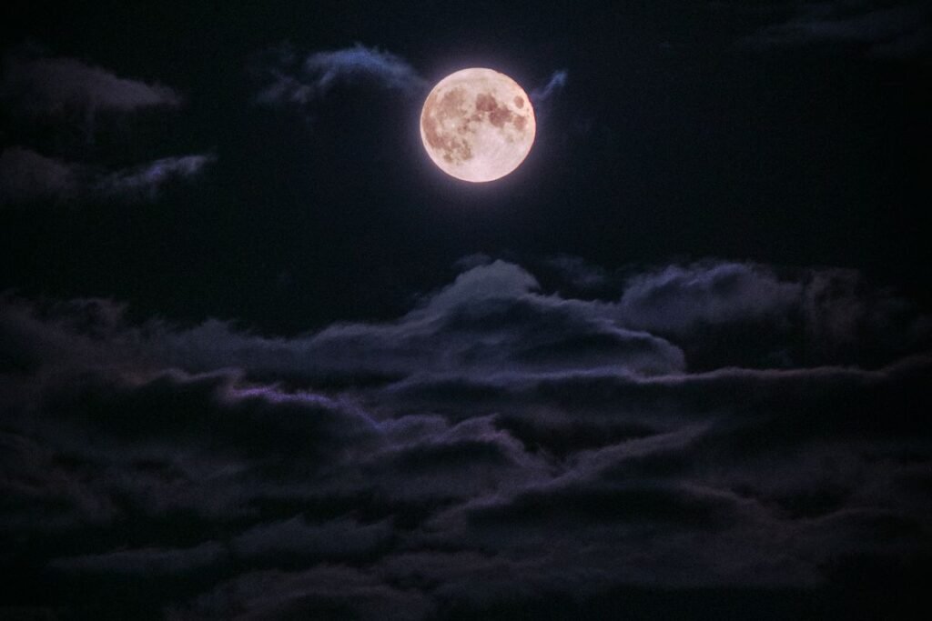 Full moon in a night sky, symbolizing the timing and prediction elements of Vedic astrology