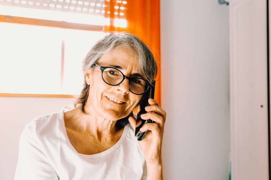 Vedic24 vs AnyTimeAstro: What You Actually Get 6 Woman on a phone call consultation, comparing Vedic24 vs AnyTimeAstro astrology services
